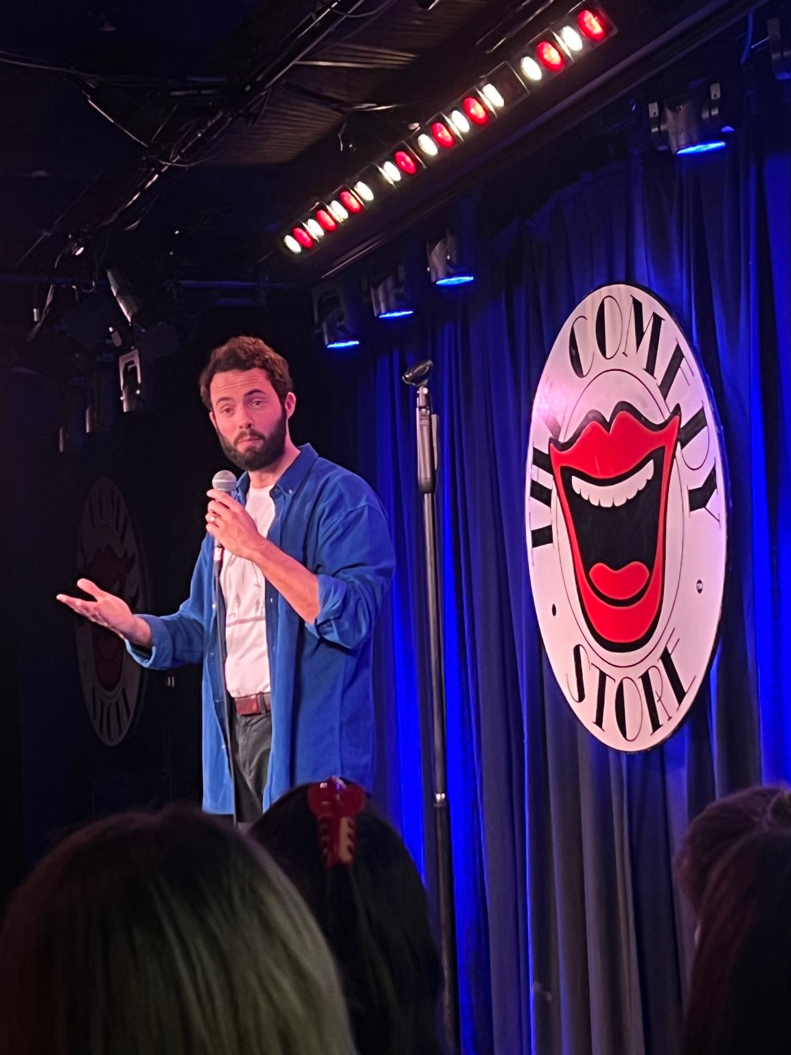 Tom performing at The Comedy Store